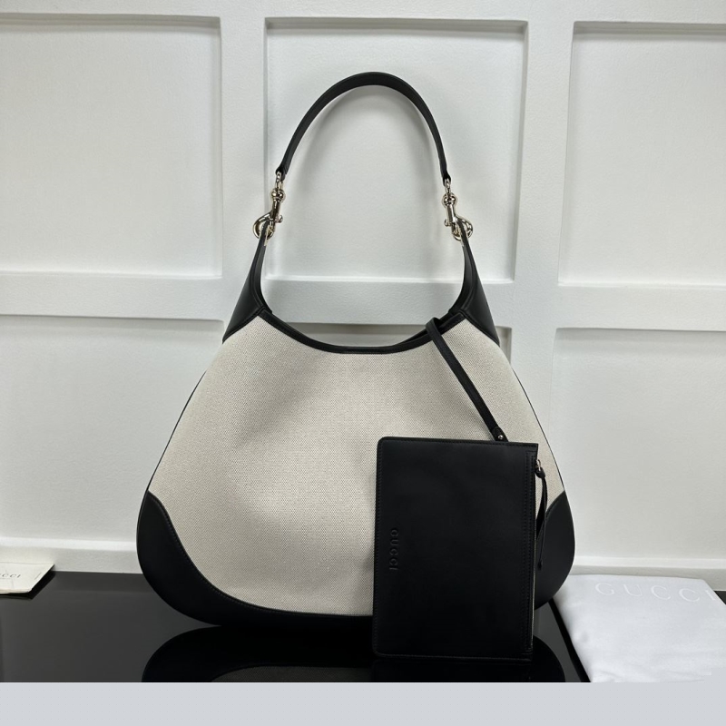 G*u*i top handle bags